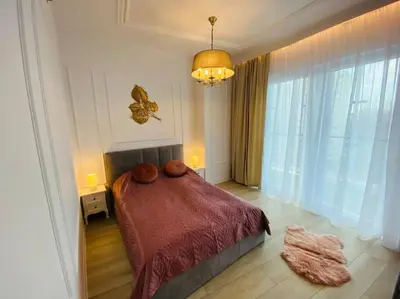 Łóżko lub łóżka w pokoju w obiekcie Gustowny apartament na Woli