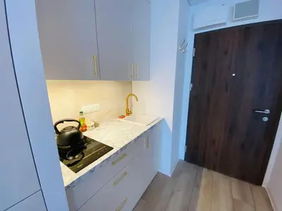 Kuchnia lub aneks kuchenny w obiekcie Gustowny apartament na Woli
