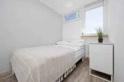 Łóżko lub łóżka w pokoju w obiekcie Comfort & Style City Center Apartments by Noclegi Renters