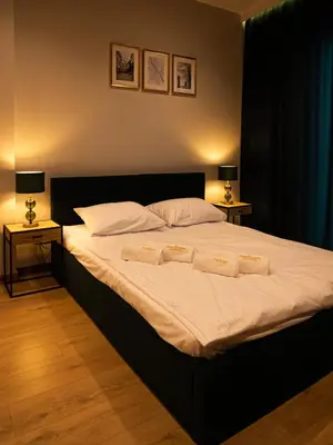 Łóżko lub łóżka w pokoju w obiekcie Warsview Apartments