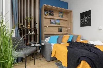 Łóżko lub łóżka w pokoju w obiekcie Business Apartments Kasprzaka by Noclegi Renters