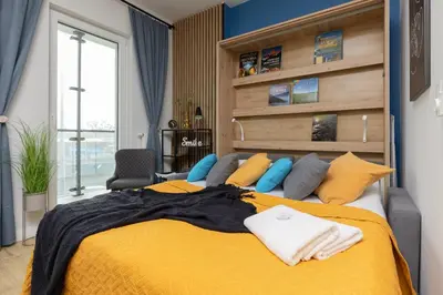 Łóżko lub łóżka w pokoju w obiekcie Business Apartments Kasprzaka by Noclegi Renters