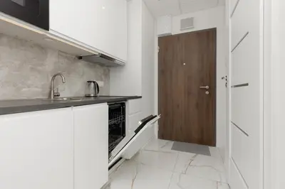 Kuchnia lub aneks kuchenny w obiekcie Business Apartments Kasprzaka by Noclegi Renters