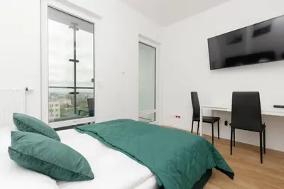 Łóżko lub łóżka w pokoju w obiekcie Business Apartments Kasprzaka by Noclegi Renters
