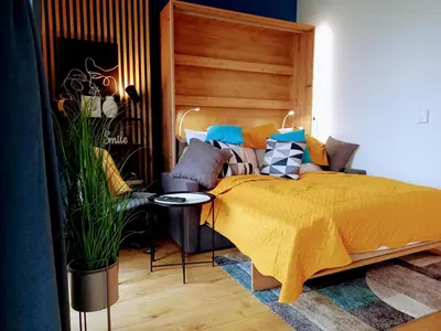 Łóżko lub łóżka w pokoju w obiekcie Business Apartments Kasprzaka by Noclegi Renters