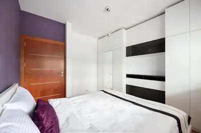 Łóżko lub łóżka w pokoju w obiekcie Pole Mokotowskie Spacious Apartment by BookingHost