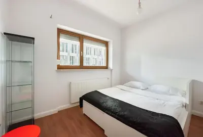 Łóżko lub łóżka w pokoju w obiekcie Pole Mokotowskie Spacious Apartment by BookingHost