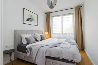 Łóżko lub łóżka w pokoju w obiekcie Woronicza Premium Apartments - 80