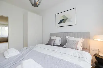 Łóżko lub łóżka w pokoju w obiekcie Woronicza Premium Apartments - 80