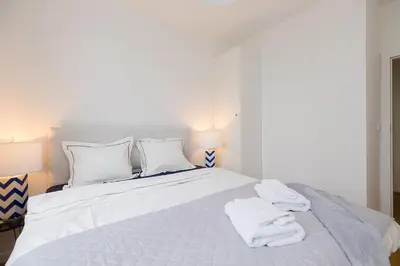 Łóżko lub łóżka w pokoju w obiekcie Woronicza Premium Apartments - 80