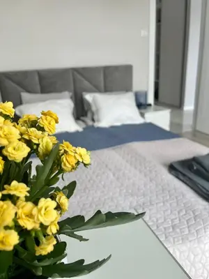 Łóżko lub łóżka w pokoju w obiekcie Życzliwa Apartment