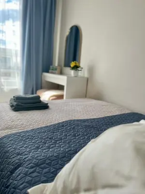 Łóżko lub łóżka w pokoju w obiekcie Życzliwa Apartment