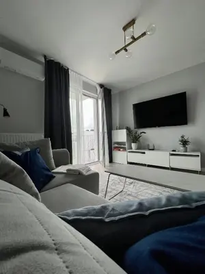 Telewizja i/lub zestaw kina domowego w obiekcie Życzliwa Apartment
