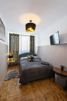Łóżko lub łóżka w pokoju w obiekcie ClickTheFlat Norblin Factory Apart Rooms