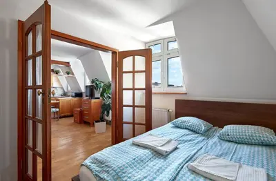 Łóżko lub łóżka w pokoju w obiekcie Tatamka Apartments