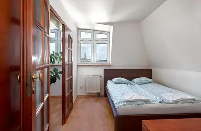 Łóżko lub łóżka w pokoju w obiekcie Tatamka Apartments