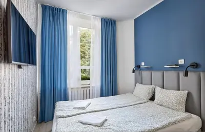 Łóżko lub łóżka w pokoju w obiekcie Tatamka Apartments