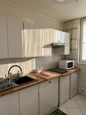 Kuchnia lub aneks kuchenny w obiekcie Apartament Bazyliańska - 100m do Metra 