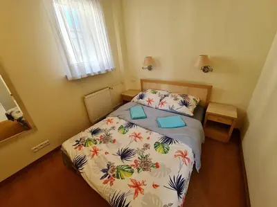 Łóżko lub łóżka w pokoju w obiekcie 10Q - Z6 Apartment 605