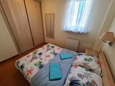 Łóżko lub łóżka w pokoju w obiekcie 10Q - Z6 Apartment 605