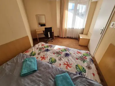 Łóżko lub łóżka w pokoju w obiekcie 10Q - Z6 Apartment 501