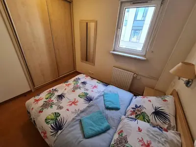 Łóżko lub łóżka w pokoju w obiekcie 10Q - Z6 Apartment 505