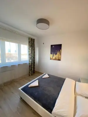 Łóżko lub łóżka w pokoju w obiekcie Murano Apartaments City Center Duo