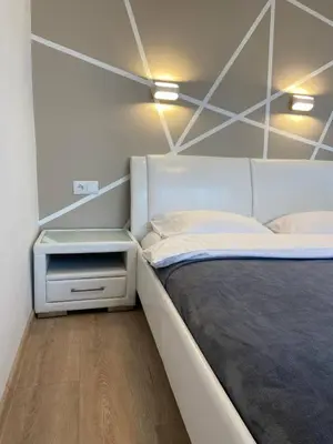 Łóżko lub łóżka w pokoju w obiekcie Murano Apartaments City Center Duo