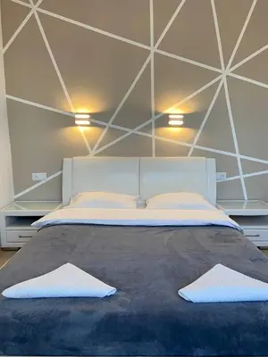 Łóżko lub łóżka w pokoju w obiekcie Murano Apartaments City Center Duo