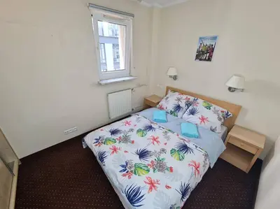 Łóżko lub łóżka w pokoju w obiekcie 10Q - Z6 Apartment 405