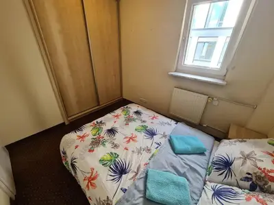 Łóżko lub łóżka w pokoju w obiekcie 10Q - Z6 Apartment 405