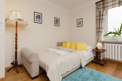 Łóżko lub łóżka w pokoju w obiekcie Metro Racławicka Cozy Studio Apartment by Noclegi Renters