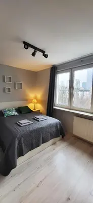 Łóżko lub łóżka w pokoju w obiekcie Vorto Apartament 2 - Warszawa Centrum