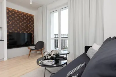 Telewizja i/lub zestaw kina domowego w obiekcie Fashionable City Center Apartment by Noclegi Renters