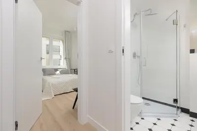 Łazienka w obiekcie Fashionable City Center Apartment by Noclegi Renters