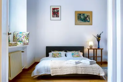 Łóżko lub łóżka w pokoju w obiekcie Grand Theatre Premium Apartment. Super central.