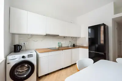 Kuchnia lub aneks kuchenny w obiekcie Marszałkowska White & Black Apartment by BookingHost