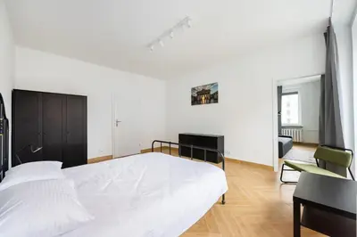 Łóżko lub łóżka w pokoju w obiekcie Marszałkowska White & Black Apartment by BookingHost