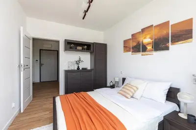 Łóżko lub łóżka w pokoju w obiekcie SuperApart Budowlana 5 - Nowoczesny Apartament