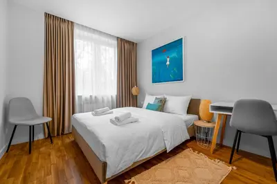 Łóżko lub łóżka w pokoju w obiekcie Elektoralna Comfort Apartment by BookingHost