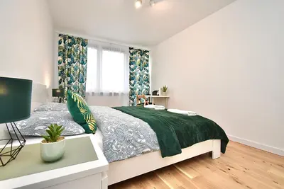 Łóżko lub łóżka w pokoju w obiekcie Rental Apartment Obrzeżna